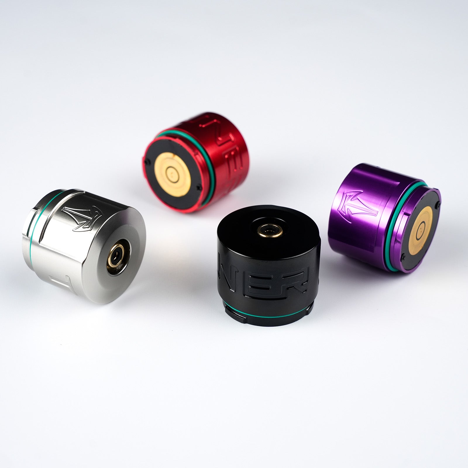 Dragoart Tuner tattoo machine RCA adapters in black, silver, red, and purple with gold connectors.
