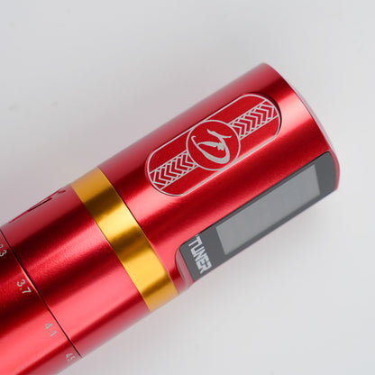 Dragoart Tuner red wireless tattoo machine side view with gold accent and digital display.