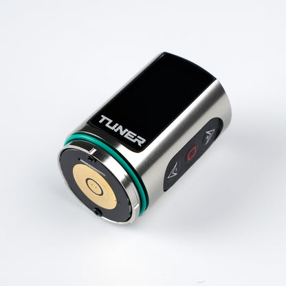 Dragoart Tuner silver wireless tattoo machine battery pack with digital display and control buttons.