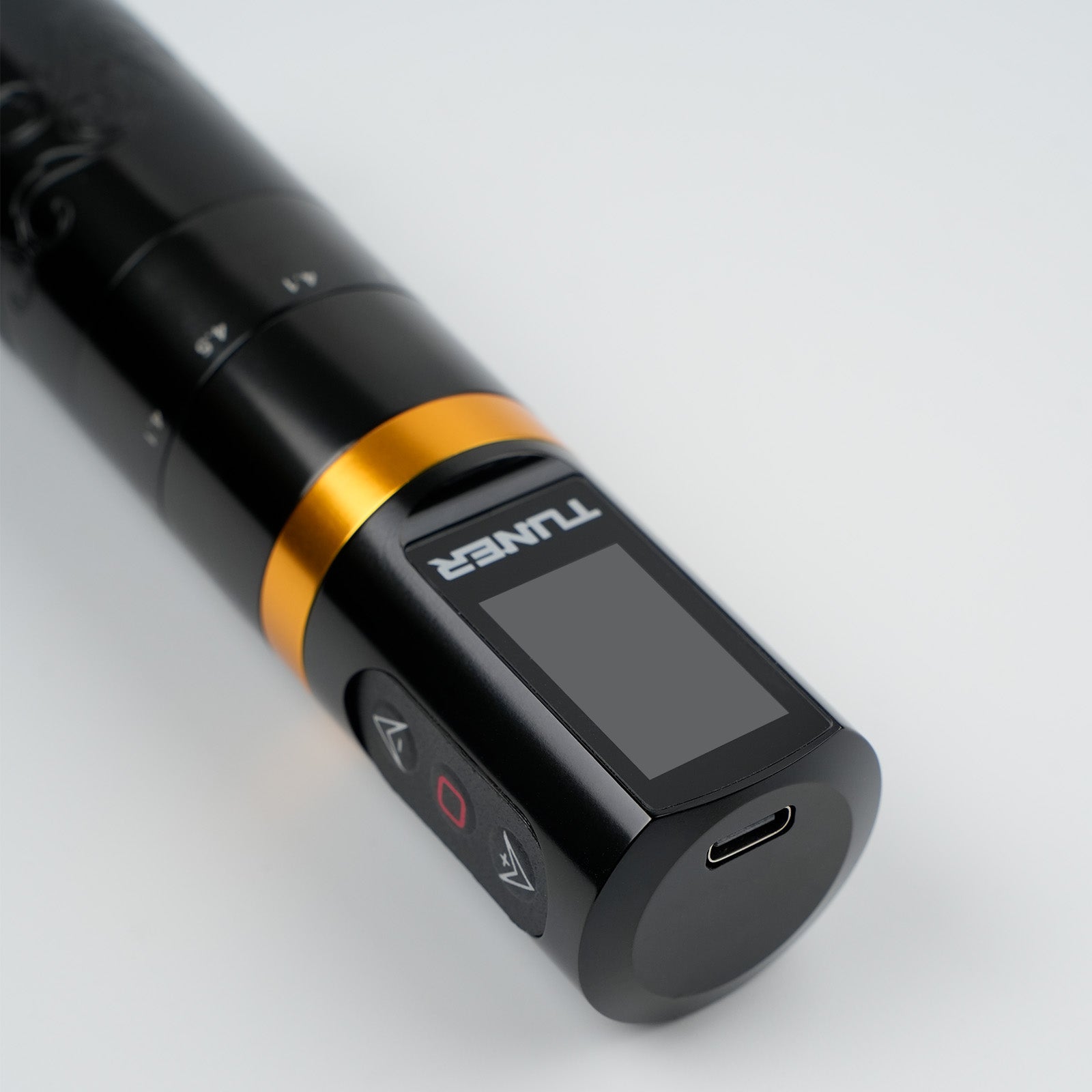 Dragoart Tuner wireless tattoo machine with digital display, control buttons, and USB-C charging port for professional tattooing