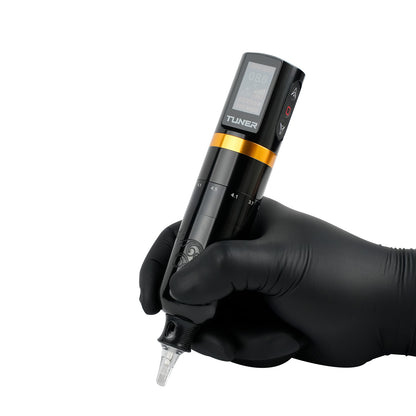 Tattoo artist holding Dragoart Tuner wireless tattoo machine with adjustable stroke and digital display during demonstration.