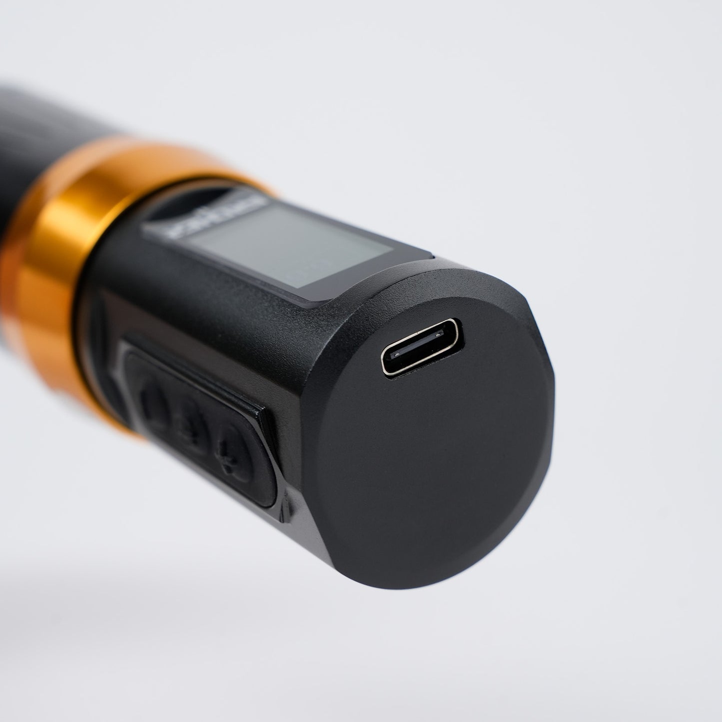 Close-up of Dragoart Archer II wireless tattoo pen battery base showing USB-C charging port and control buttons